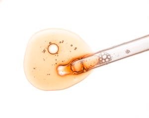 liquid orange gel serum screen microscope white isolated background