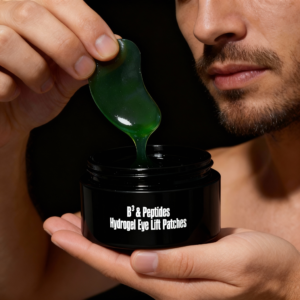 Peptides Eye Lift Patches – B3 & Peptides Hydrogel Eye Lift Patches by Face Re-Charge | man lifting a glossy dark green hydrogel eye patch from its Jar